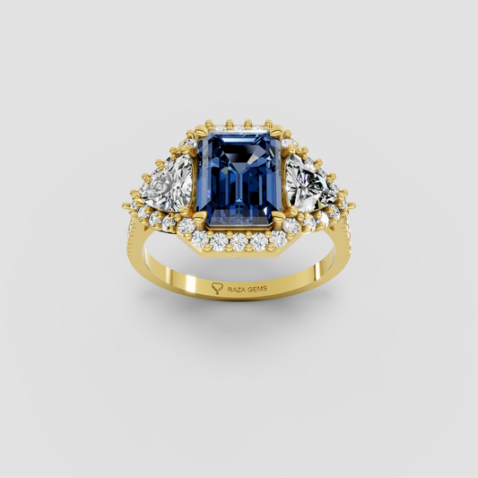 Millie – Emerald Cut Blue Sapphire & Moissanite Halo Statement Ring in 18KT Gold