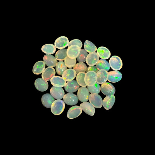 Natural White Ethiopian Opal Stone 10.11 Carats Oval Cabochon Shape 5 x 4 mm