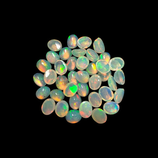 Natural White Ethiopian Opal Stone 11.06 Carats Oval Cabochon Shape 5 x 4 mm