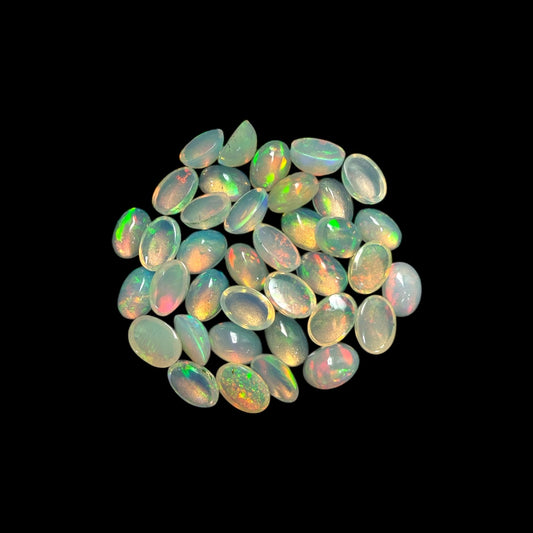 Natural White Ethiopian Opal Stone 13.55 Carats Oval Cabochon Shape 6 x 4 mm