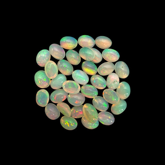 Natural White Ethiopian Opal Stone 19.75 Carats Oval Cabochon Shape 7 x 5 mm
