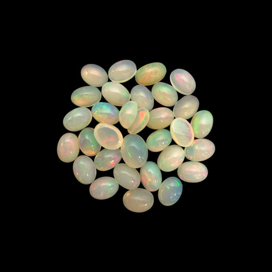 Natural White Ethiopian Opal Stone 19.87 Carats Oval Cabochon Shape 7 x 5 mm