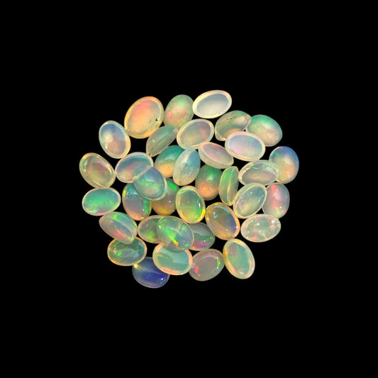 Natural White Ethiopian Opal Stone 20.80 Carats Oval Cabochon Shape 7 x 5 mm