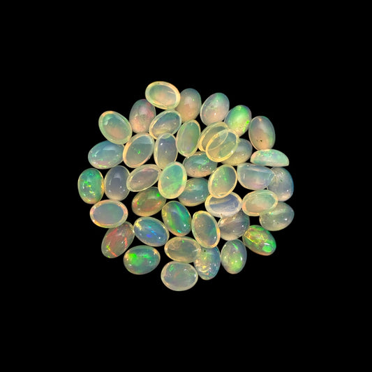 Natural White Ethiopian Opal Stone 23.05 Carats Oval Cabochon Shape 7 x 5 mm