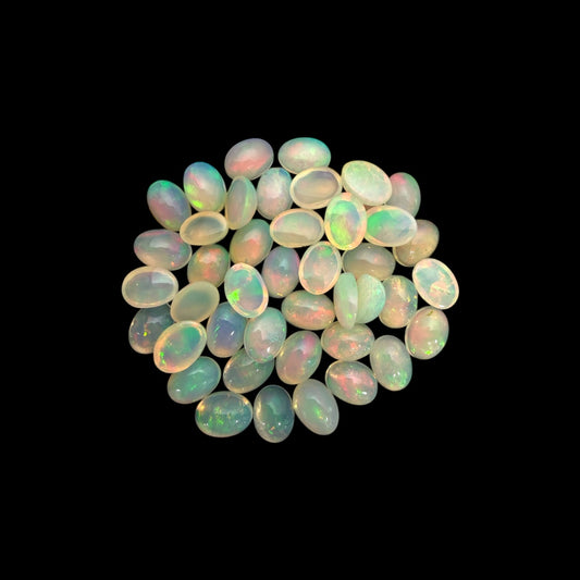 Natural White Ethiopian Opal Stone 24.14 Carats Oval Cabochon Shape 7 x 5 mm