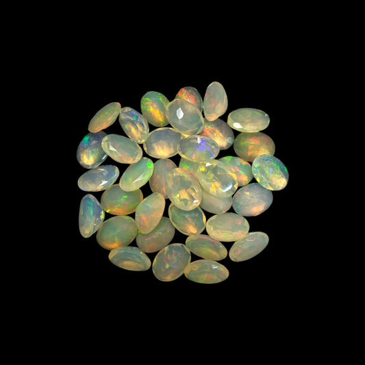 Natural White Ethiopian Opal Stone 25.73 Carats Oval Cabochon Shape 8 x 6 mm