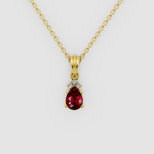 Lottie – Pear Ruby Solitaire Drop Pendant with Moissanite Accent in 18KT Gold