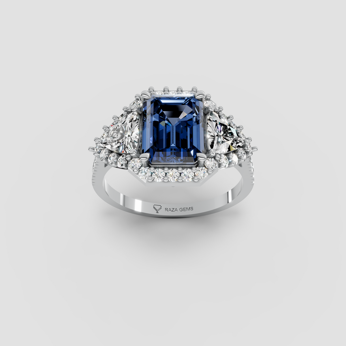 Millie – Emerald Cut Blue Sapphire & Moissanite Halo Statement Ring in 18KT Gold