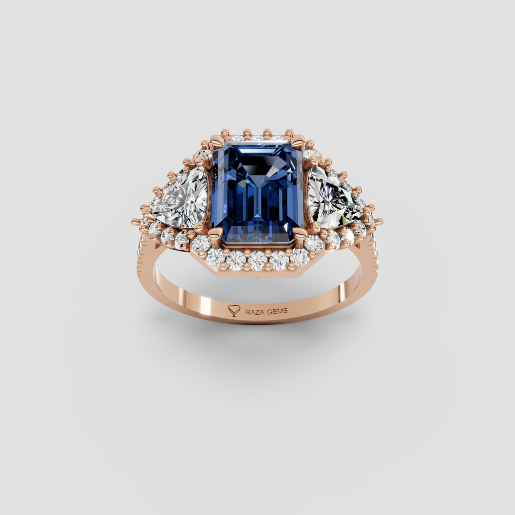 Millie – Emerald Cut Blue Sapphire & Moissanite Halo Statement Ring in 18KT Gold