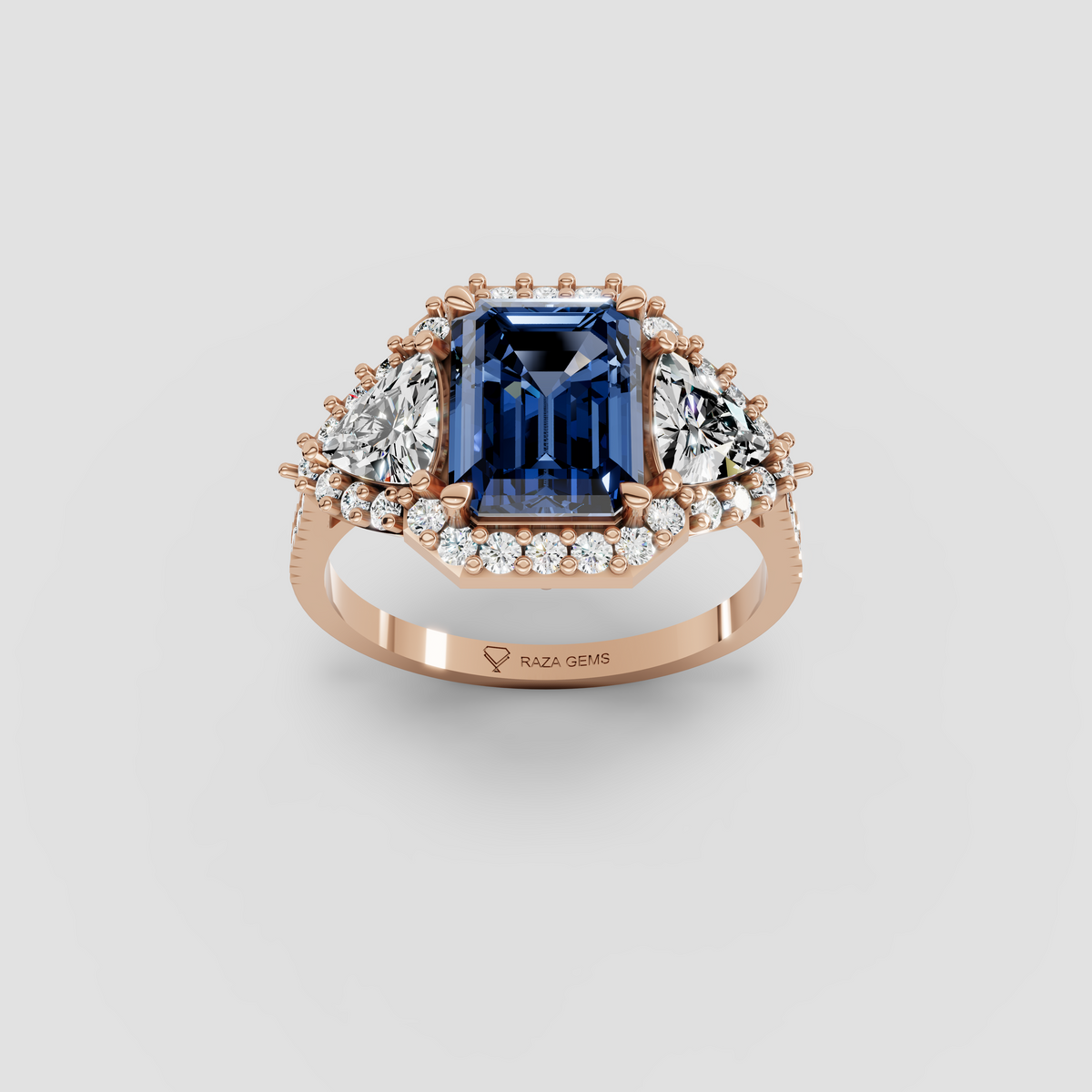 Millie – Emerald Cut Blue Sapphire & Moissanite Halo Statement Ring in 18KT Gold