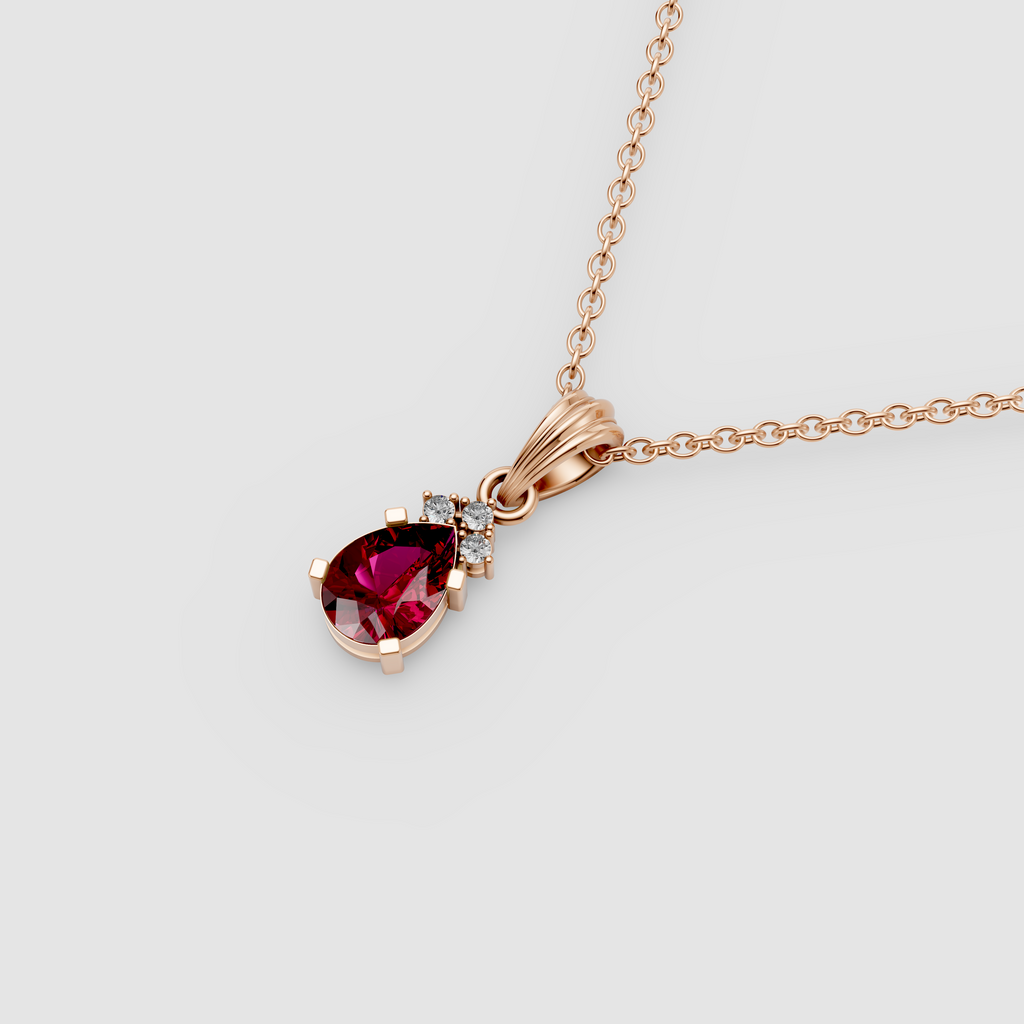 Lottie – Pear Ruby Solitaire Drop Pendant with Moissanite Accent in 18KT Gold
