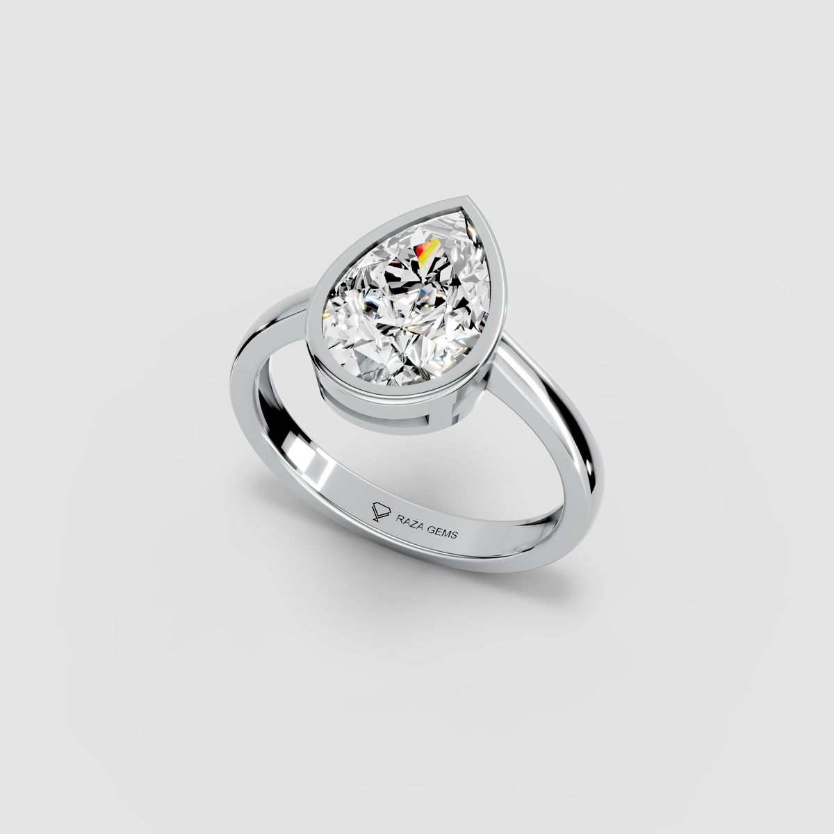 Aura – 18K Gold Pear-Cut Moissanite Bezel Solitaire Ring