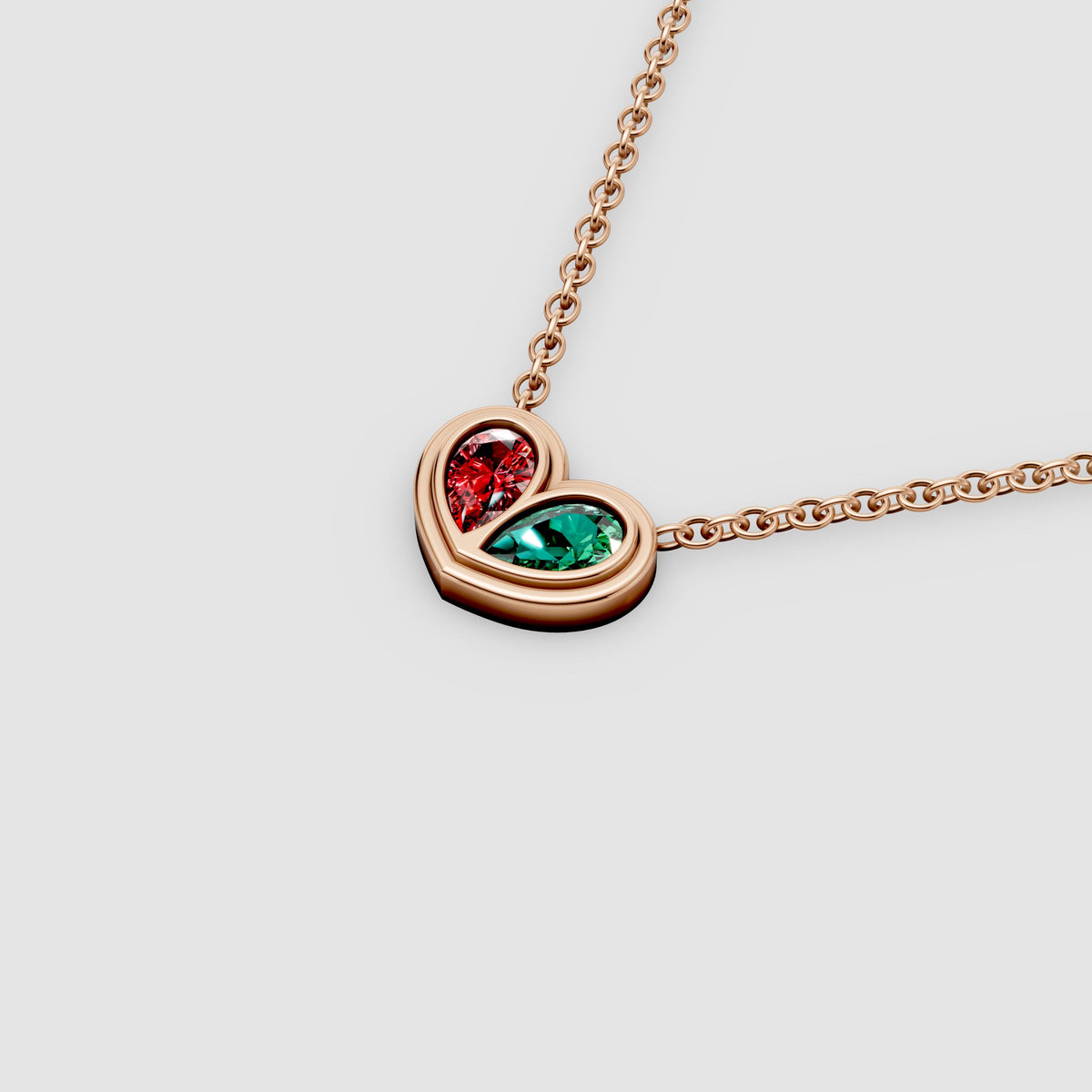 Amora – Pear Emerald & Ruby Bezel-Set Heart Pendant in 18KT Gold