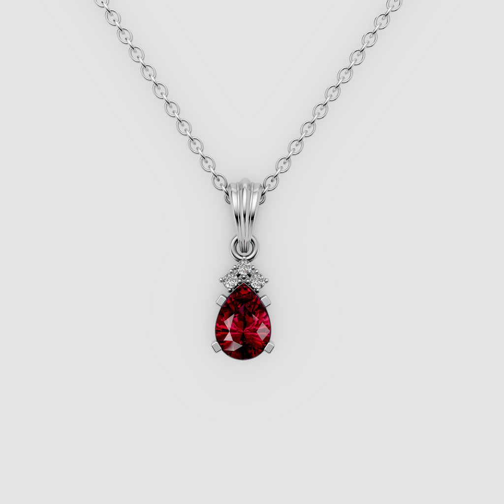 Lottie – Pear Ruby Solitaire Drop Pendant with Moissanite Accent in 18KT Gold