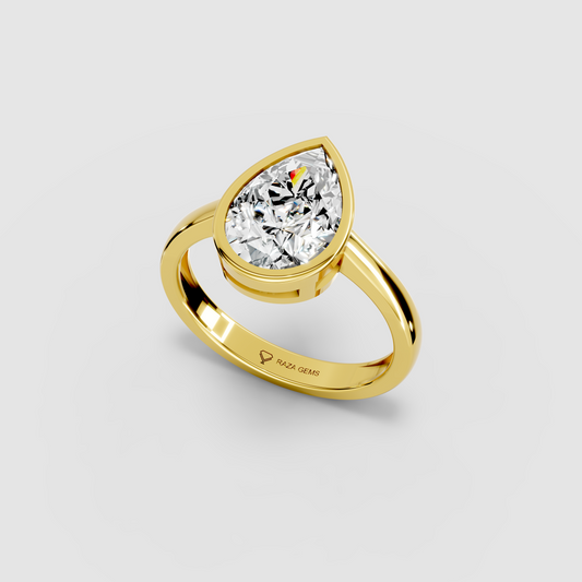 Aura – 18K Gold Pear-Cut Moissanite Bezel Solitaire Ring