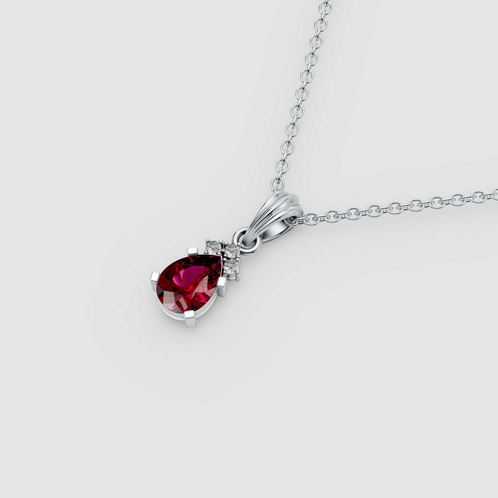 Lottie – Pear Ruby Solitaire Drop Pendant with Moissanite Accent in 18KT Gold