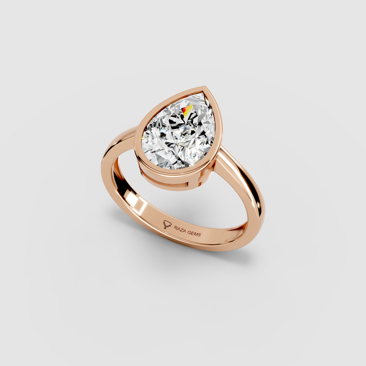 Aura – 18K Gold Pear-Cut Moissanite Bezel Solitaire Ring