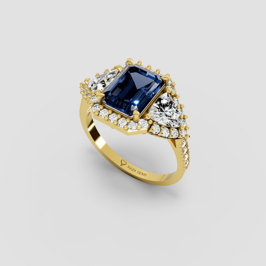 Millie – Emerald Cut Blue Sapphire & Moissanite Halo Statement Ring in 18KT Gold