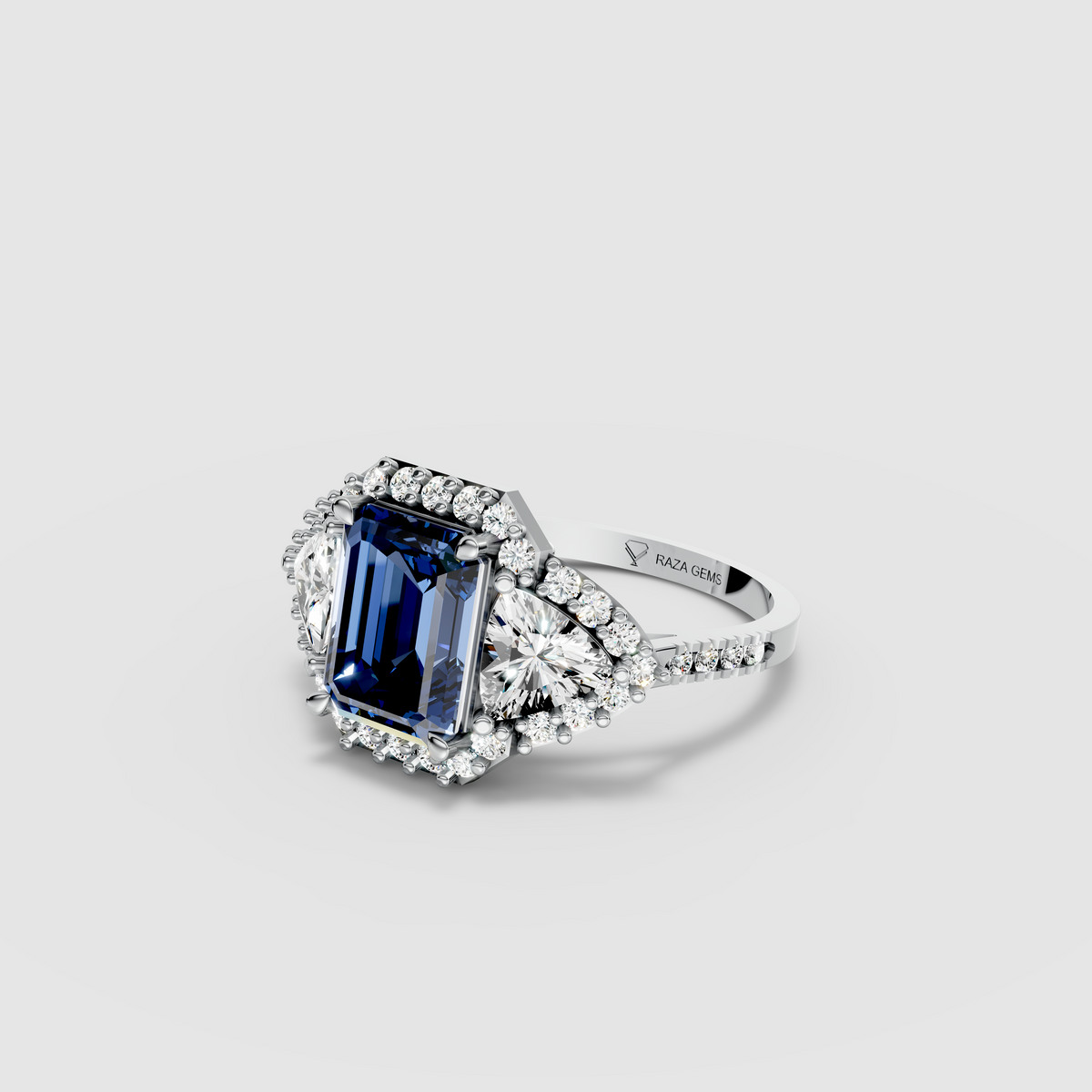 Millie – Emerald Cut Blue Sapphire & Moissanite Halo Statement Ring in 18KT Gold