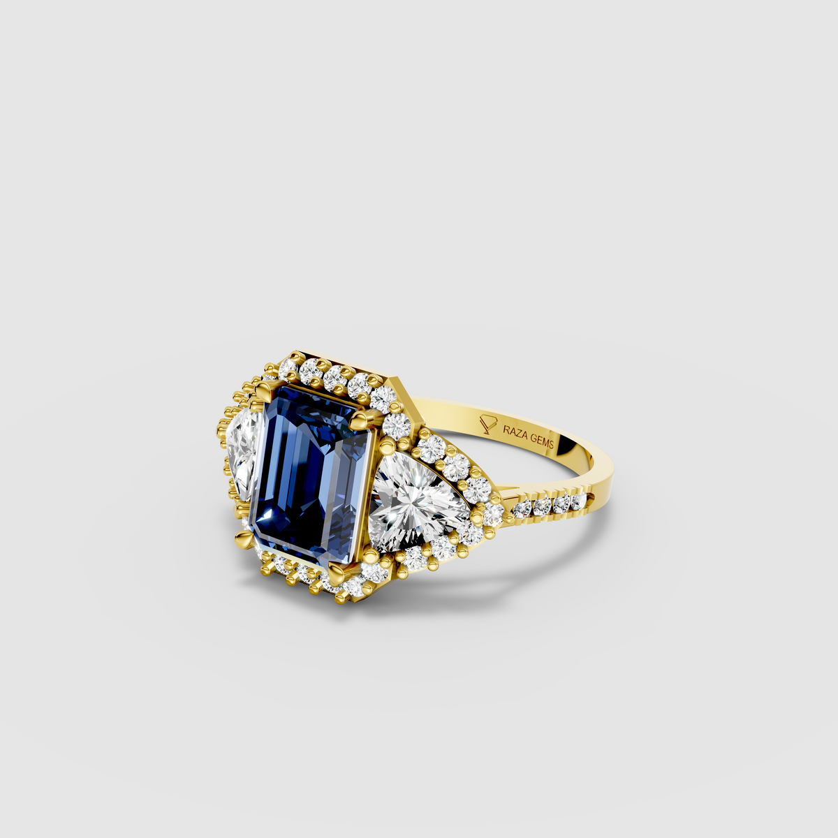 Millie – Emerald Cut Blue Sapphire & Moissanite Halo Statement Ring in 18KT Gold