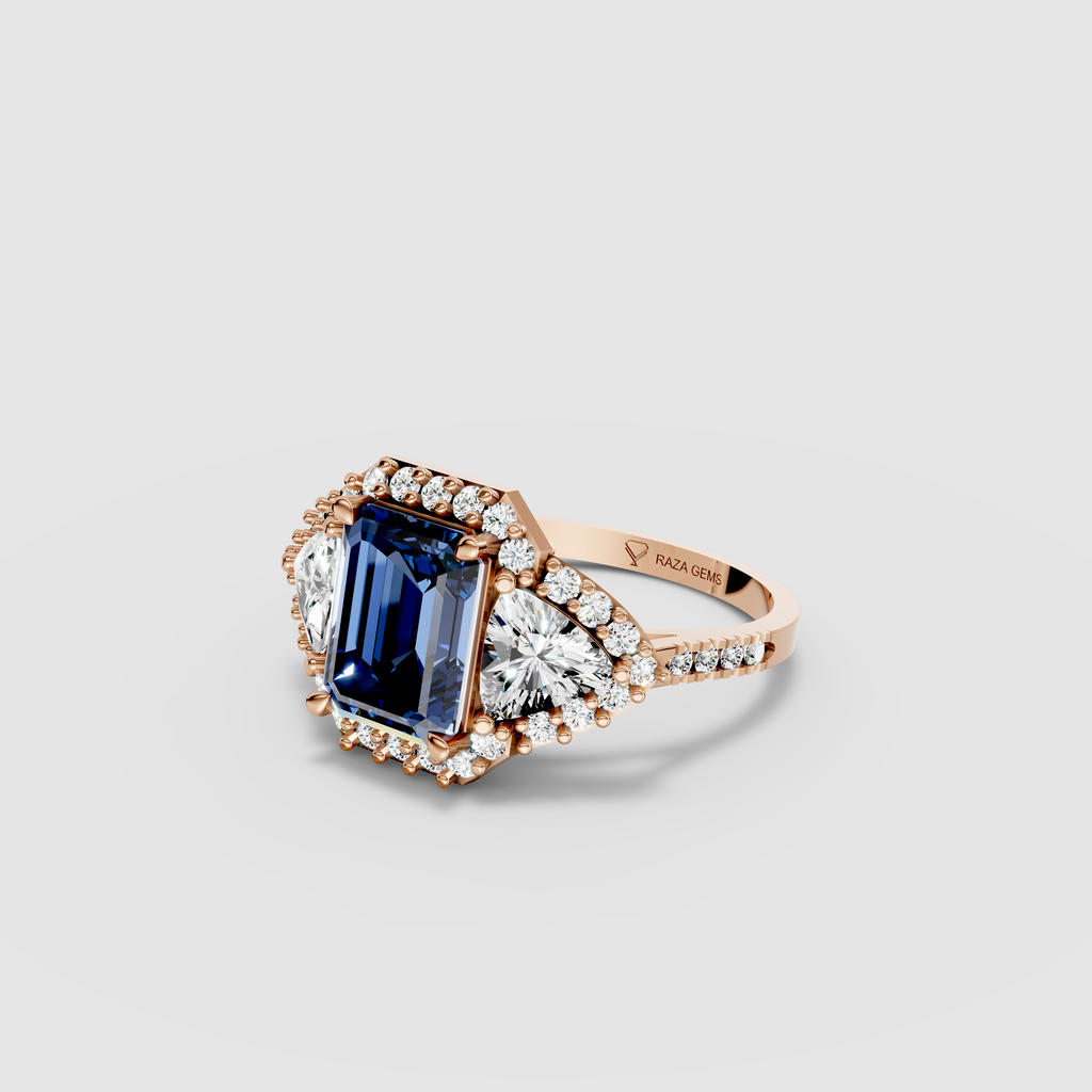 Millie – Emerald Cut Blue Sapphire & Moissanite Halo Statement Ring in 18KT Gold