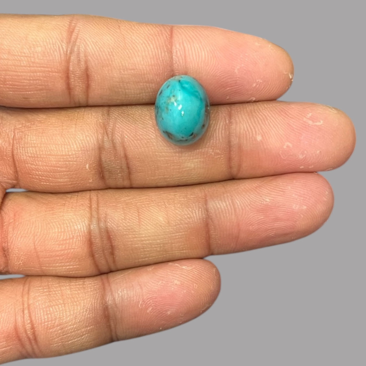 Blue Turquoise Stone 12.34 Carats 15.4 x 13.8 x 8.8 mm in Oval