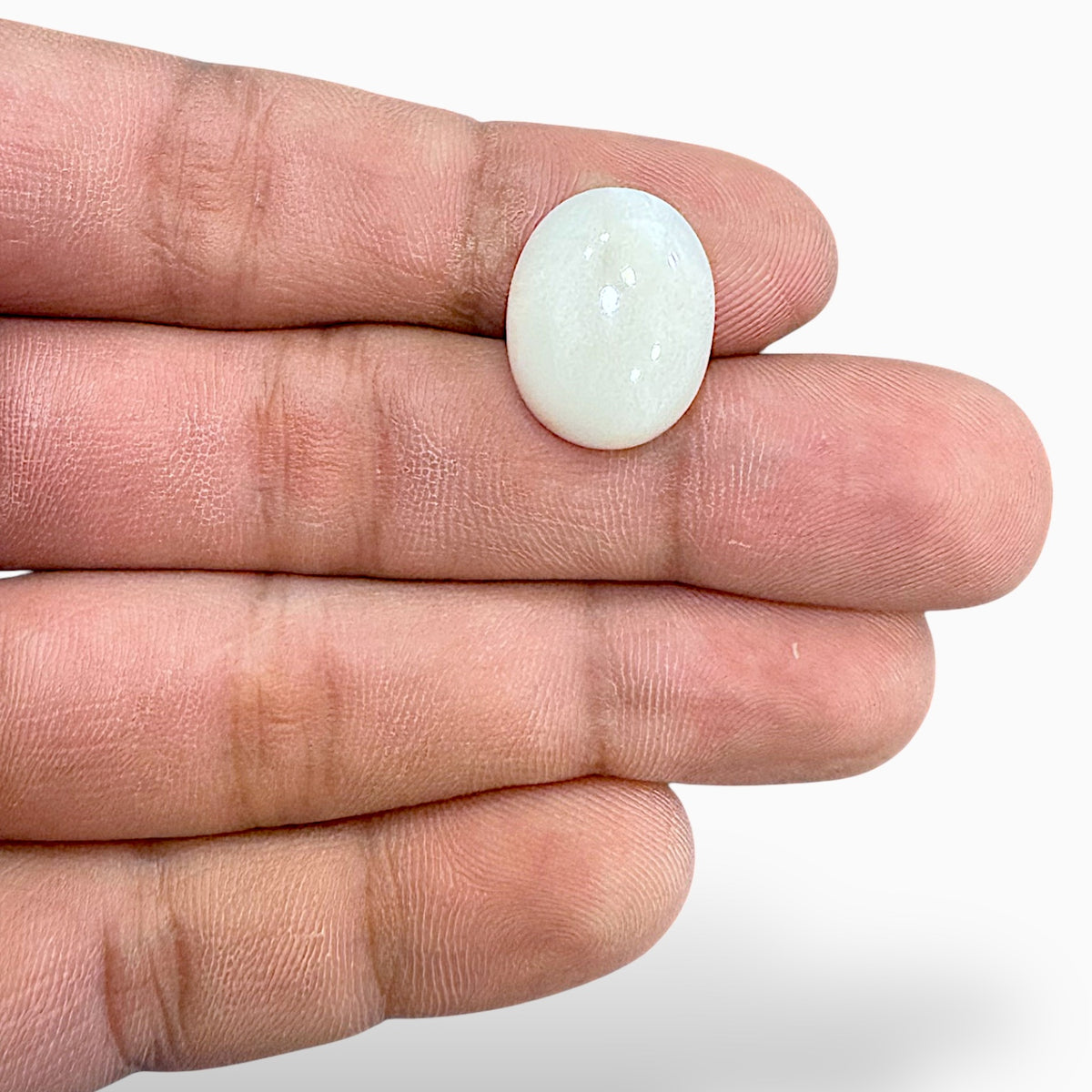 Natural White Coral Moonga Stone 12.57 Carats Oval Cabochon Shape 17.9x13.9mm