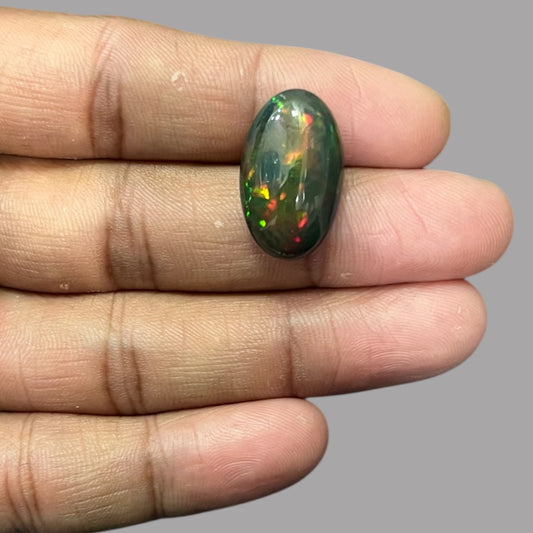 Natural Black Ethiopian Opal Stone 10.98 Carats Oval Cabochon Shape Size 22.5 x 13.7 x 8.5 mm
