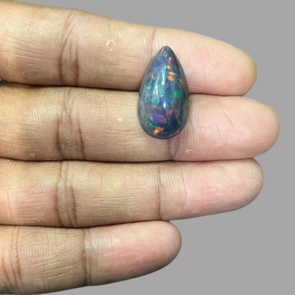 Natural Black Ethiopian Opal Stone 11.33 Carats Pear Cabochon Shape Size 22.7 x 12.9 x 9.4 mm