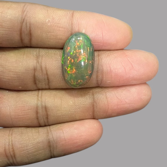 Natural Black Ethiopian Opal Stone 12.71 Carats Oval Cabochon Shape Size 24.5 x 14.4 x 6.9 mm