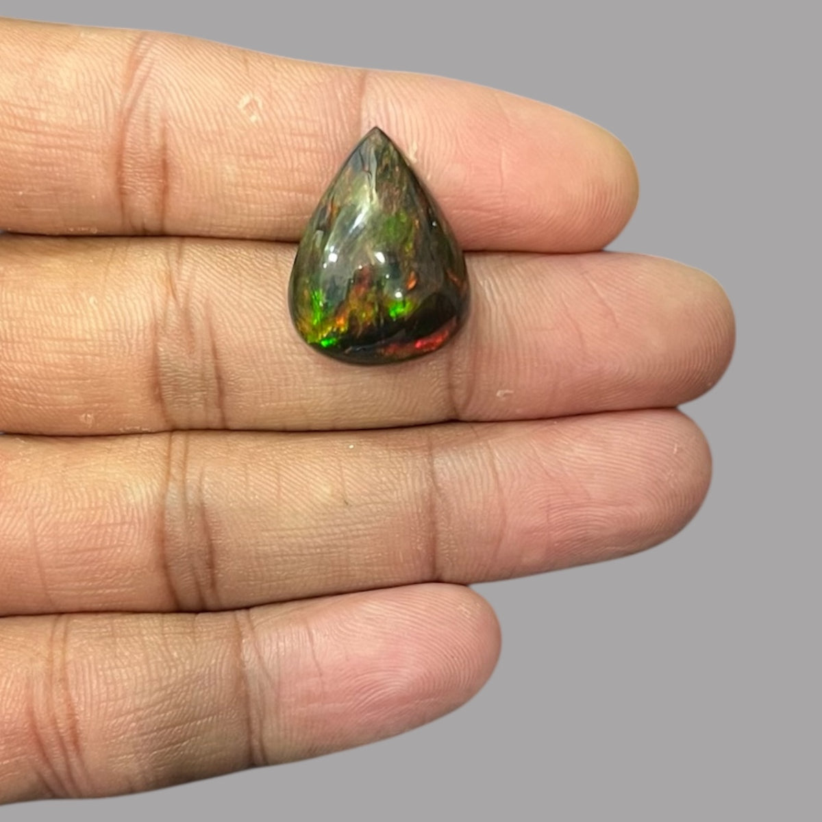 Natural Black Ethiopian Opal Stone 14.08 Carats Pear Cabochon Shape Size 22.2 x 17 x 9.7 mm