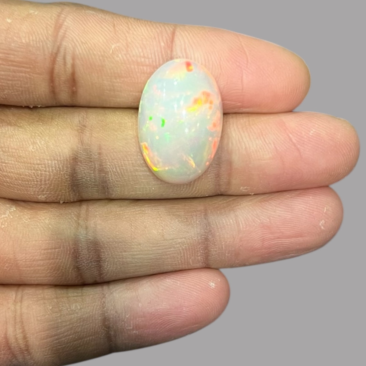Natural Black Ethiopian Opal Stone 14.82 Carats Oval Cabochon Shape Size 23.3 x 15.8 x 9.2 mm
