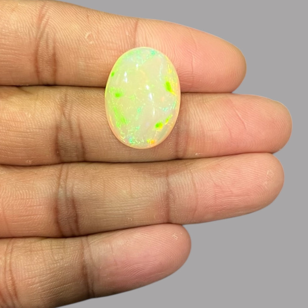 Natural Black Ethiopian Opal Stone 18.12 Carats Oval Cabochon Shape Size 22.7 x 16.9 x 10.1 mm