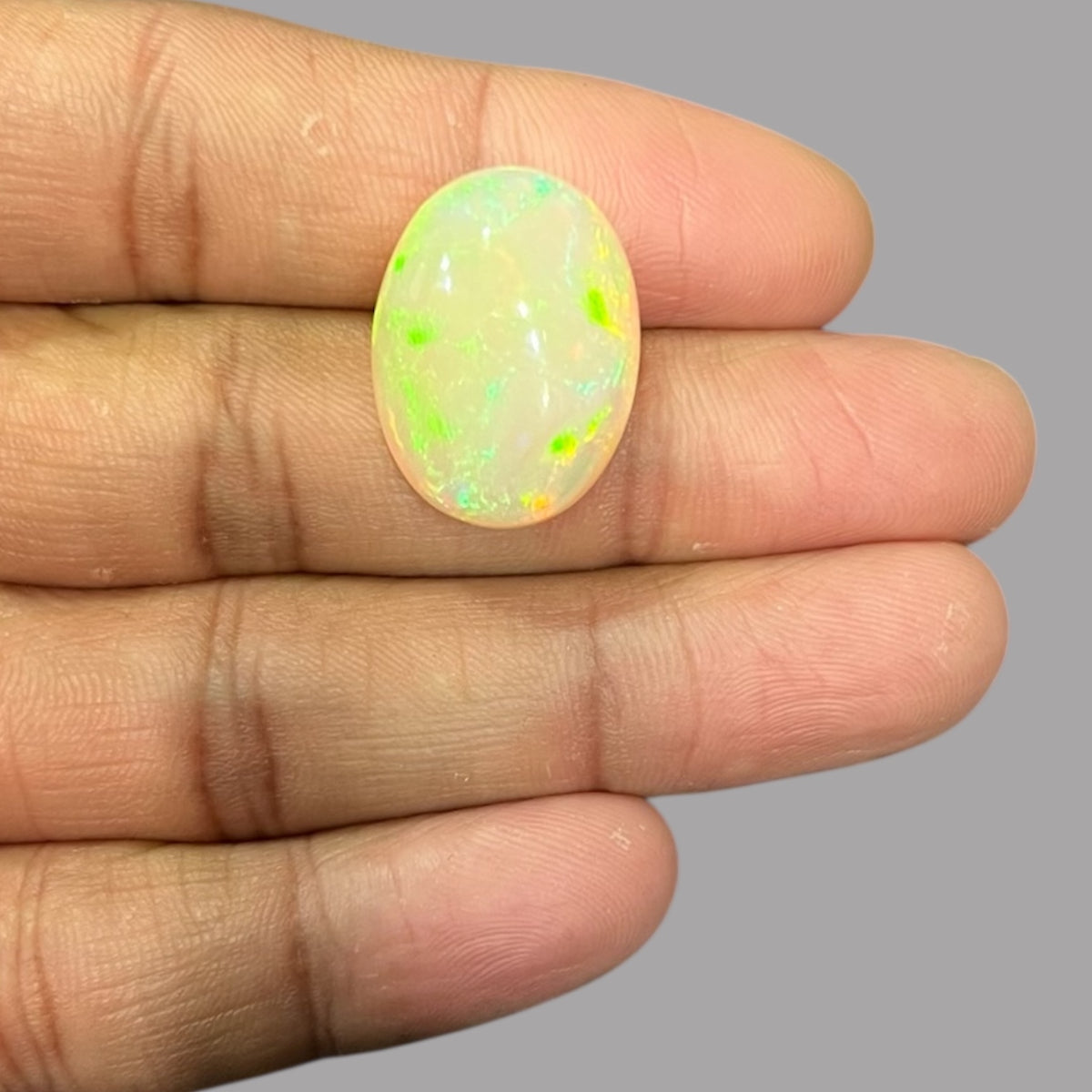 Natural Black Ethiopian Opal Stone 18.12 Carats Oval Cabochon Shape Size 22.7 x 16.9 x 10.1 mm