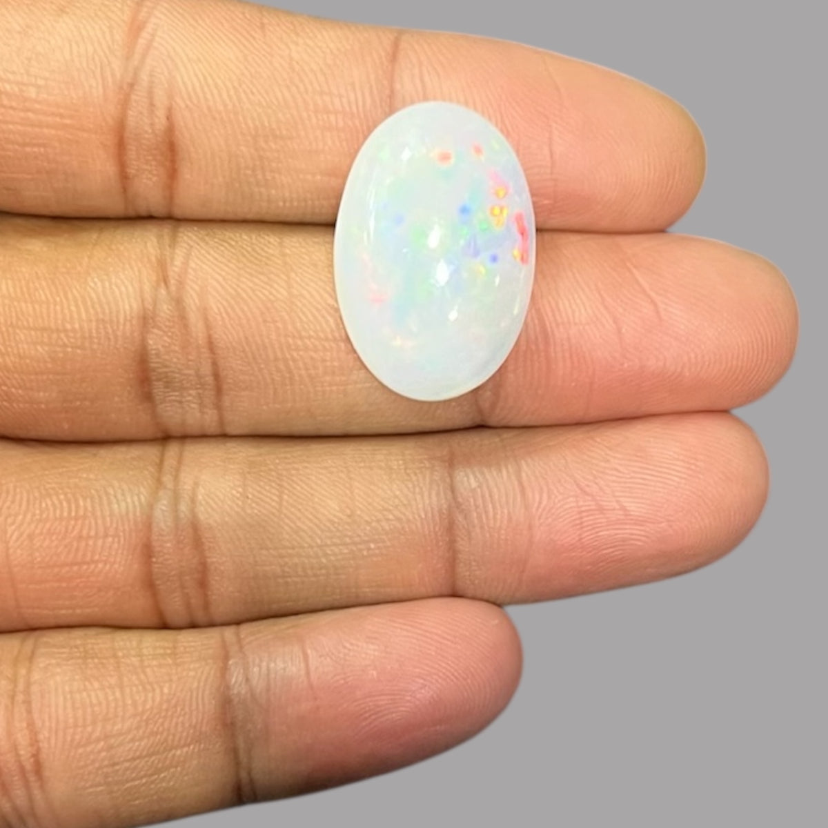 Natural Black Ethiopian Opal Stone 19.19 Carats Oval Cabochon Shape Size 24.4 x 16.6 x 8.1 mm