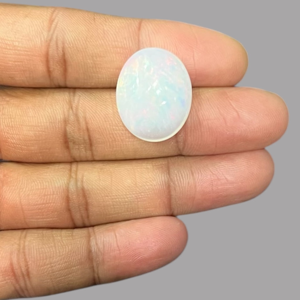 Natural Black Ethiopian Opal Stone 21.61 Carats Oval Cabochon Shape Size 22.5 x 18.4 x 10.2 mm