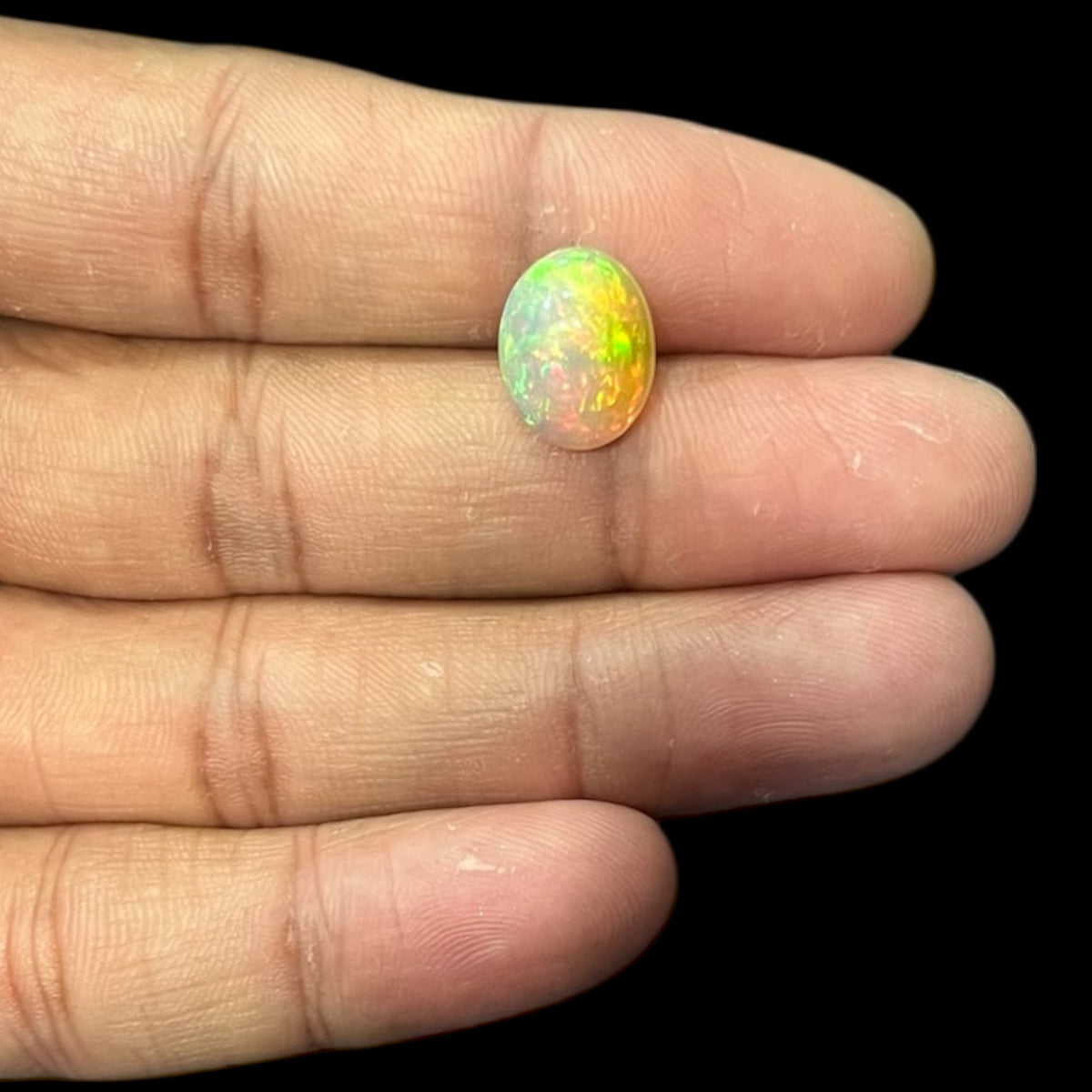 Natural Black Ethiopian Opal Stone 4.19 Carats Oval Cabochon Shape Size 13.4 x 10.5 x 6.1 mm