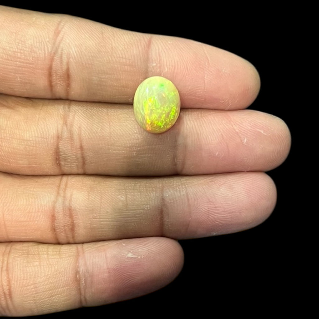 Natural Black Ethiopian Opal Stone 4.89 Carats Oval Cabochon Shape Size 13.2 x 10.9 x 7.1 mm