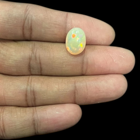 Natural Black Ethiopian Opal Stone 5.11 Carats Oval Cabochon Shape Size 14 x 10.2 x 7.4 mm