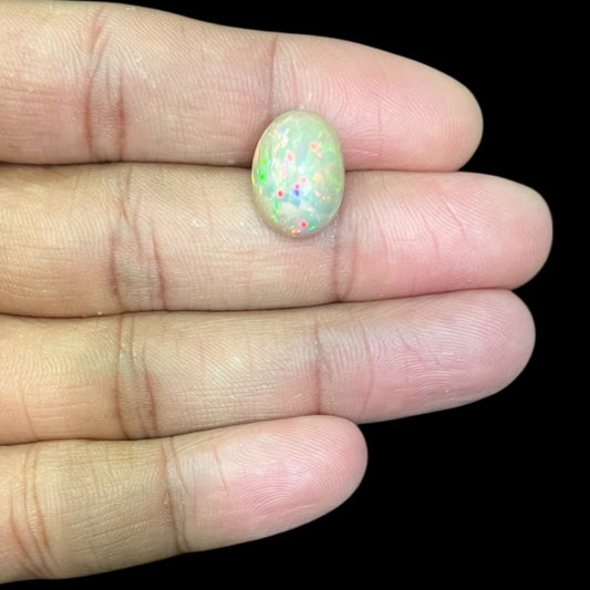 Natural Black Ethiopian Opal Stone 5.89 Carats Oval Cabochon Shape Size 15 x 11.2 x 7.5 mm