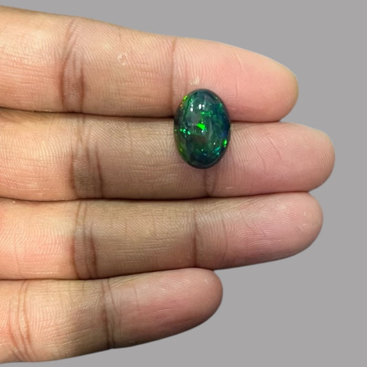Natural Black Ethiopian Opal Stone 7.25 Carats Oval Cabochon Shape Size 16.4 x 12 x 7.5 mm