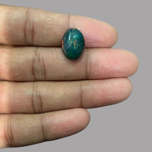 Natural Black Ethiopian Opal Stone 7.01 Carats Oval Cabochon Shape Size 16.4 x 12.2 x 7 mm 