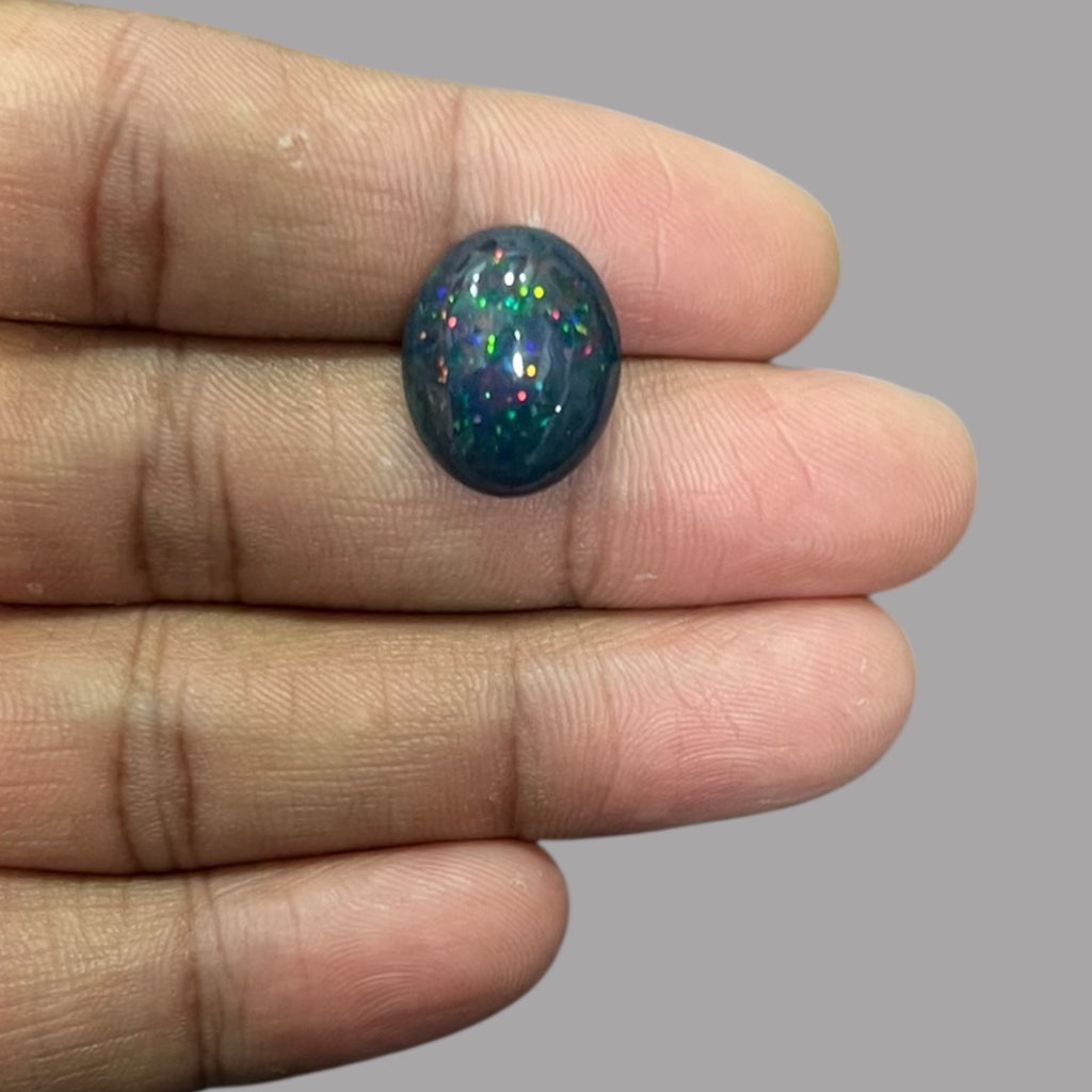 Natural Black Ethiopian Opal Stone 7.72 Carats Oval Cabochon Shape Size 17.2 x 14 x 7.5 mm