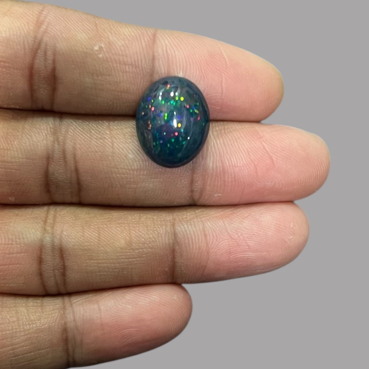 Natural Black Ethiopian Opal Stone 7.72 Carats Oval Cabochon Shape Size 17.2 x 14 x 7.5 mm