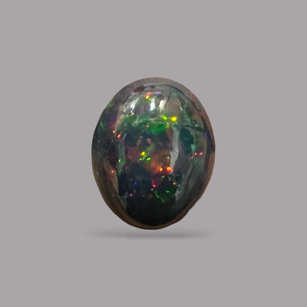 Natural Black Ethiopian Opal Stone 7.72 Carats Oval Cabochon Shape Size 17.2 x 14 x 7.5 mm