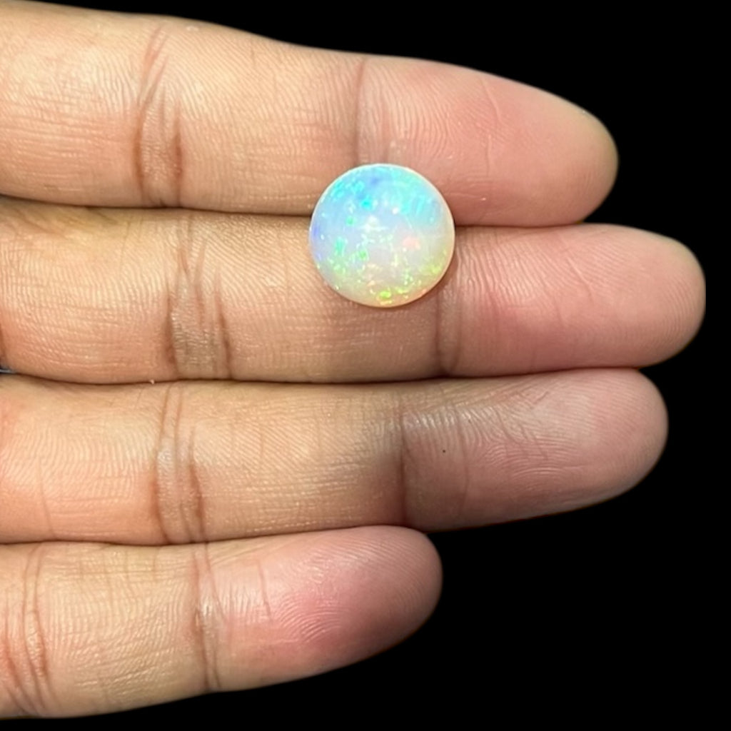 Natural Black Ethiopian Opal Stone 7.72 Carats Round Cabochon Shape Size 14.7 x 8.2 mm