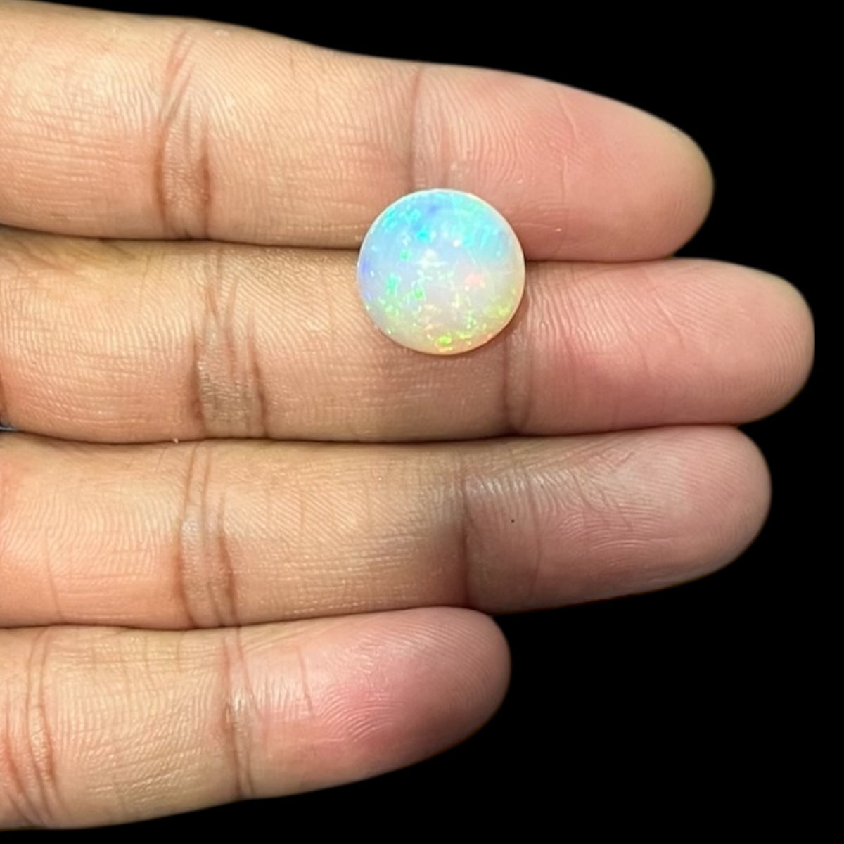 Natural Black Ethiopian Opal Stone 7.72 Carats Round Cabochon Shape Size 14.7 x 8.2 mm