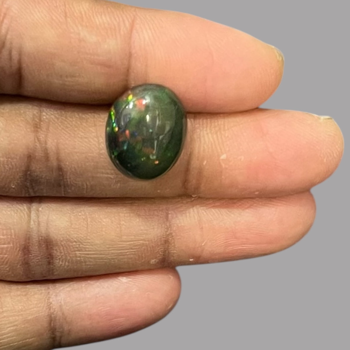 Natural Black Ethiopian Opal Stone 9.01 Carats Oval Cabochon Shape Size 17.3 x 13.9 x 8.4 mm 