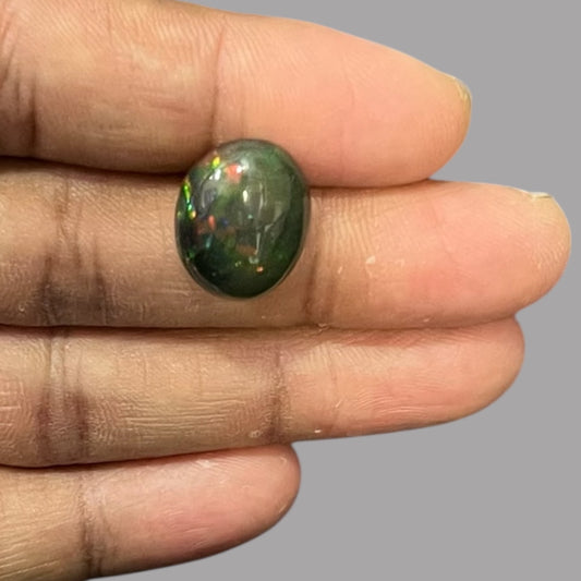 Natural Black Ethiopian Opal Stone 9.01 Carats Oval Cabochon Shape Size 17.3 x 13.9 x 8.4 mm 