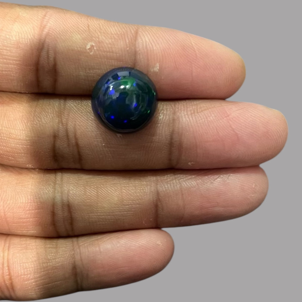 Natural Black Ethiopian Opal Stone 9.49 Carats Round Cabochon Shape Size 15.5 x 9 mm